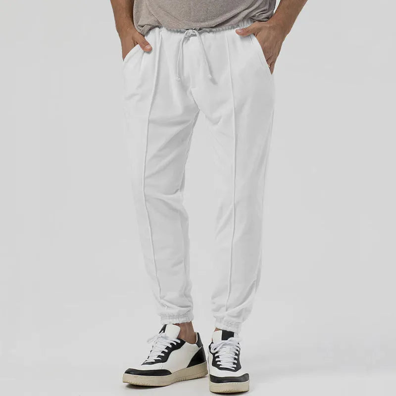Men's grey casual tapered sweatpants with an elasticated waistband and straight-leg design