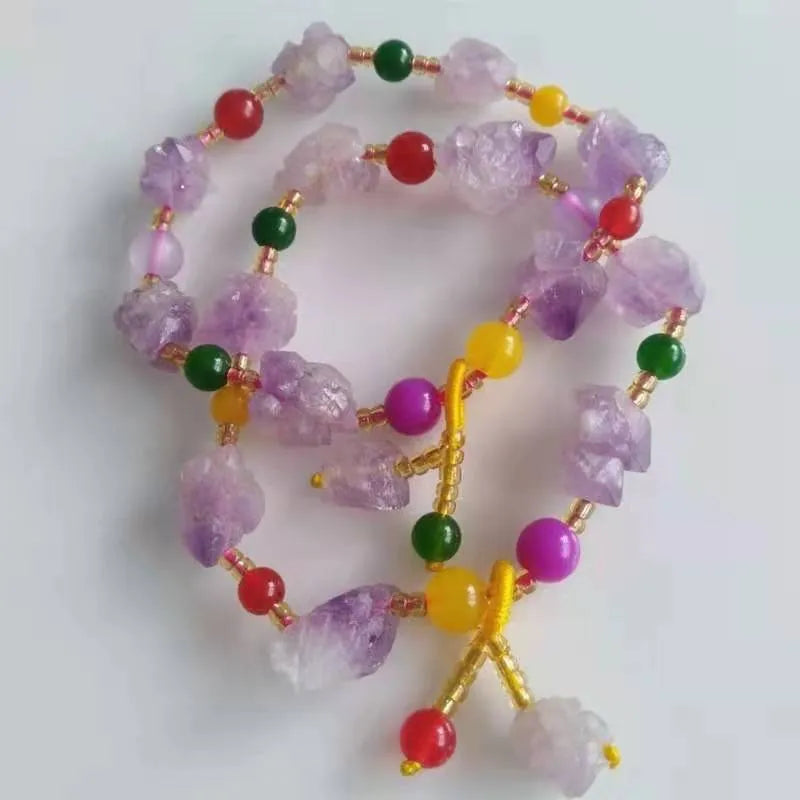 Purple natural shaped amethyst bead bracelet for women with a fu character charm.