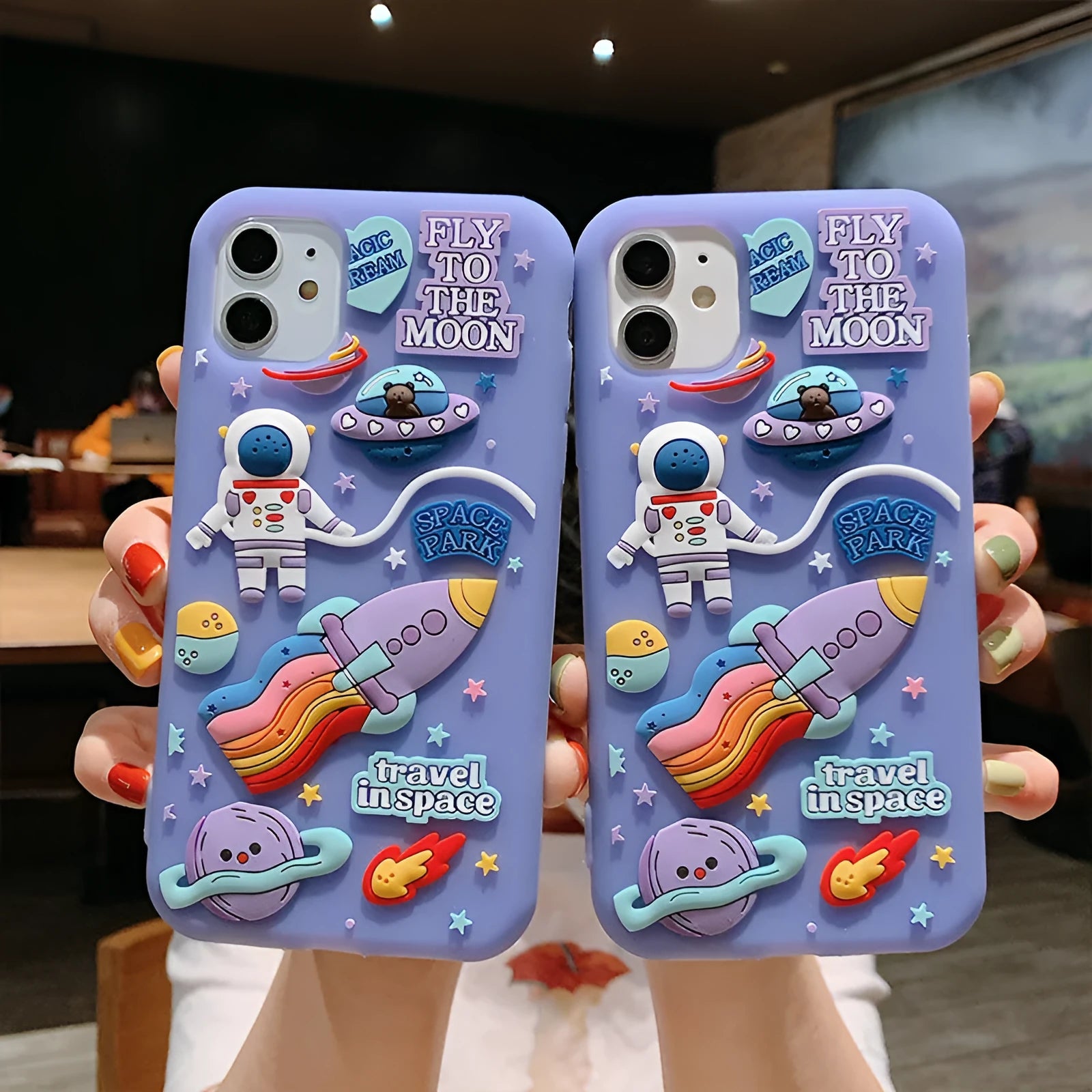 Purple silicone iPhone case with cartoon astronaut design for multiple iPhone models