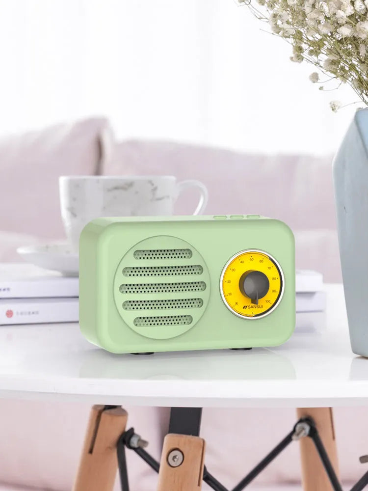 Portable Bluetooth speaker with FM radio in wood colour finish showing front speaker grille and control buttons