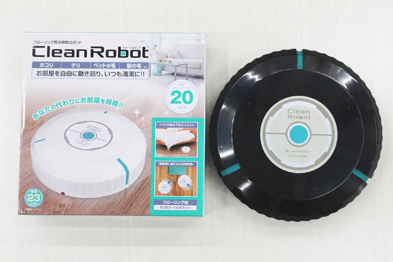 Black or white automatic robot vacuum cleaner with wide cleaning head on wooden floor.