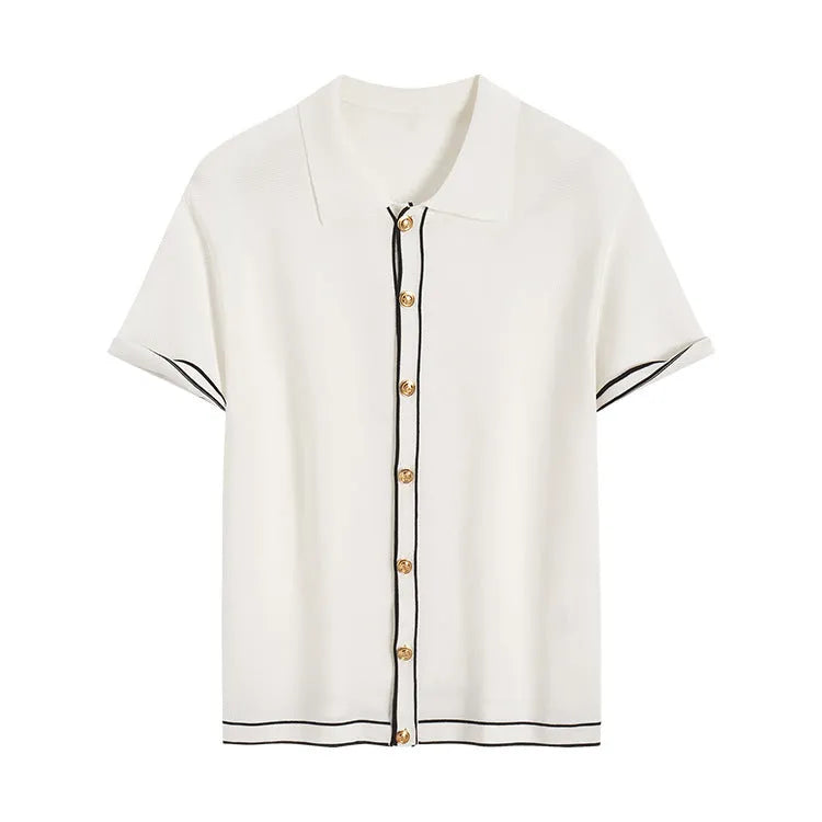 White short sleeve cardigan with dark contrast lapels laid flat.