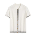 White short sleeve cardigan with dark contrast lapels laid flat.
