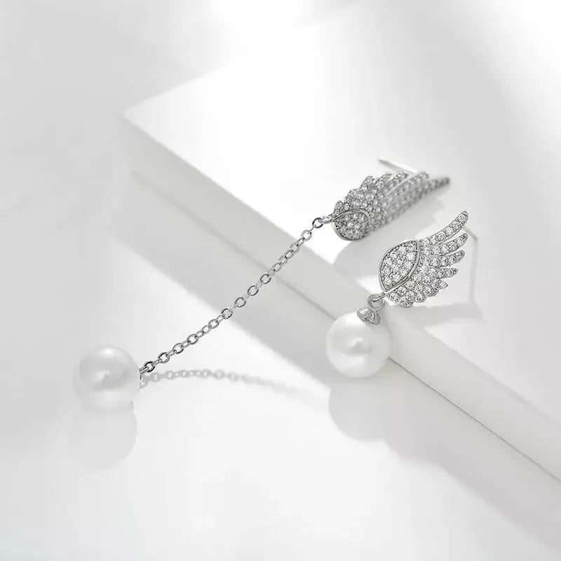 Silver angel wing earrings with diamond-treated metal and gold-plated inlaid gemstones in platinum colour