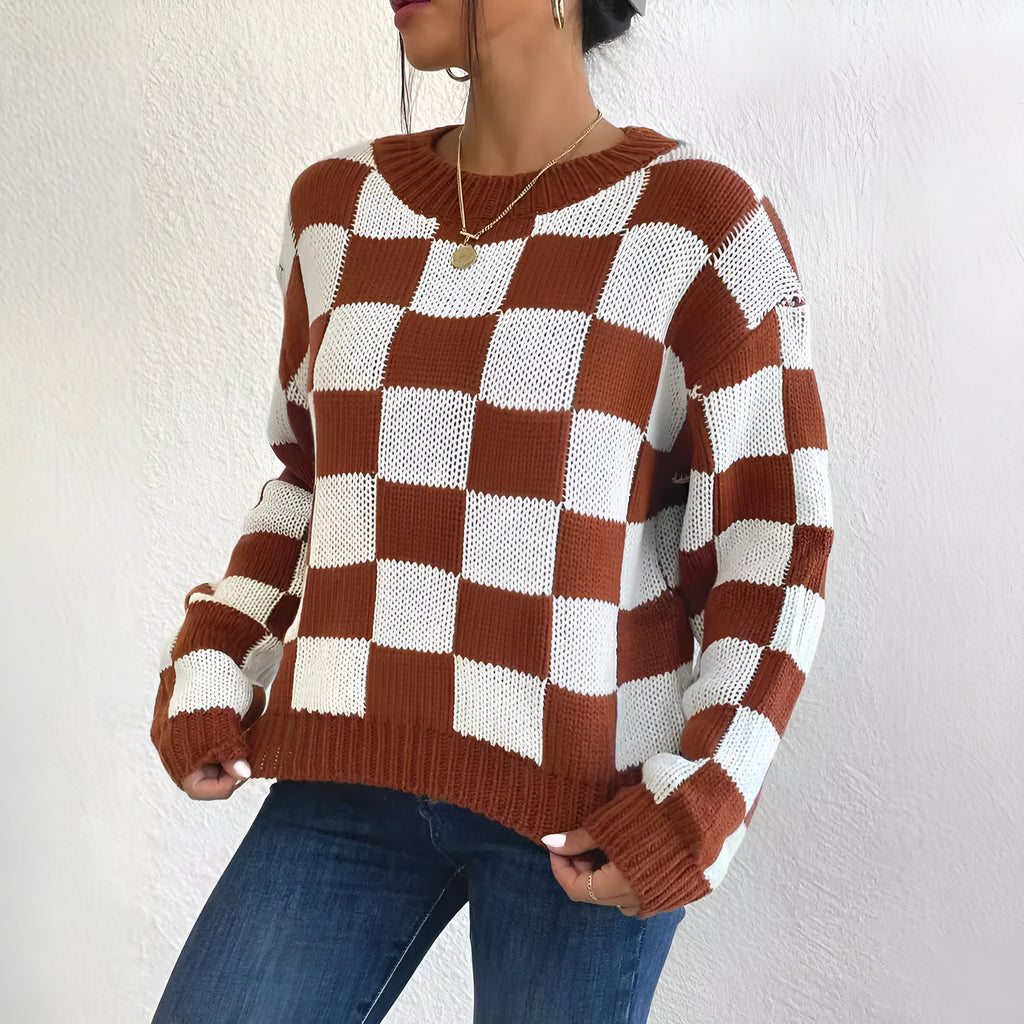 Dark brown loose fit acrylic pullover sweater with a chessboard plaid pattern and long sleeves.