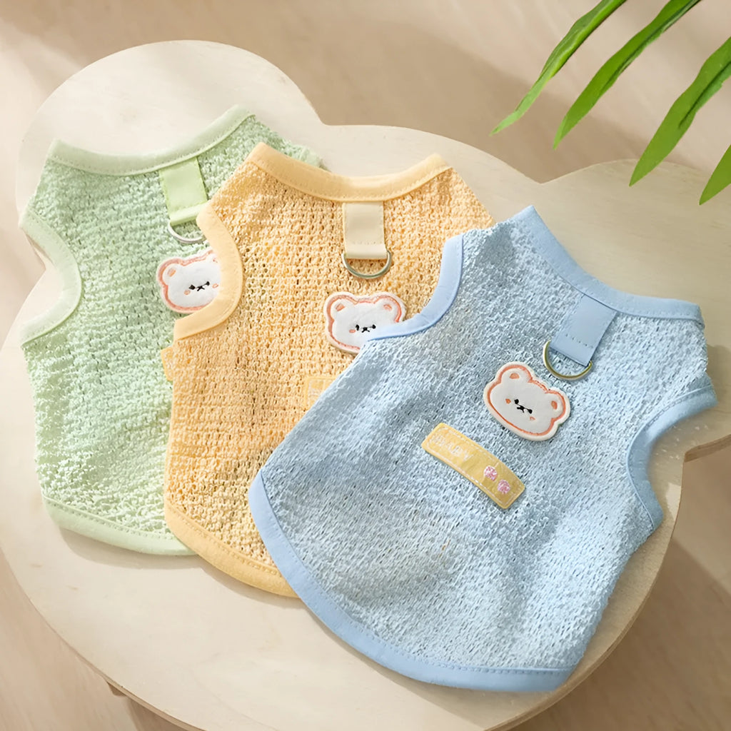 Green knitted cat clothes with a hollowed-out bear patch cartoon design.