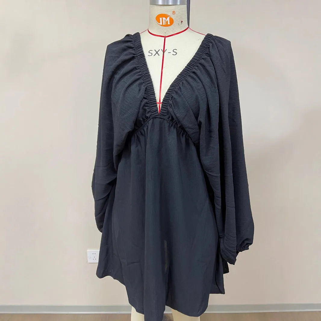 Women's apricot V-neck dress with puff sleeves and a flounced swing skirt, also available in green, black, and white.