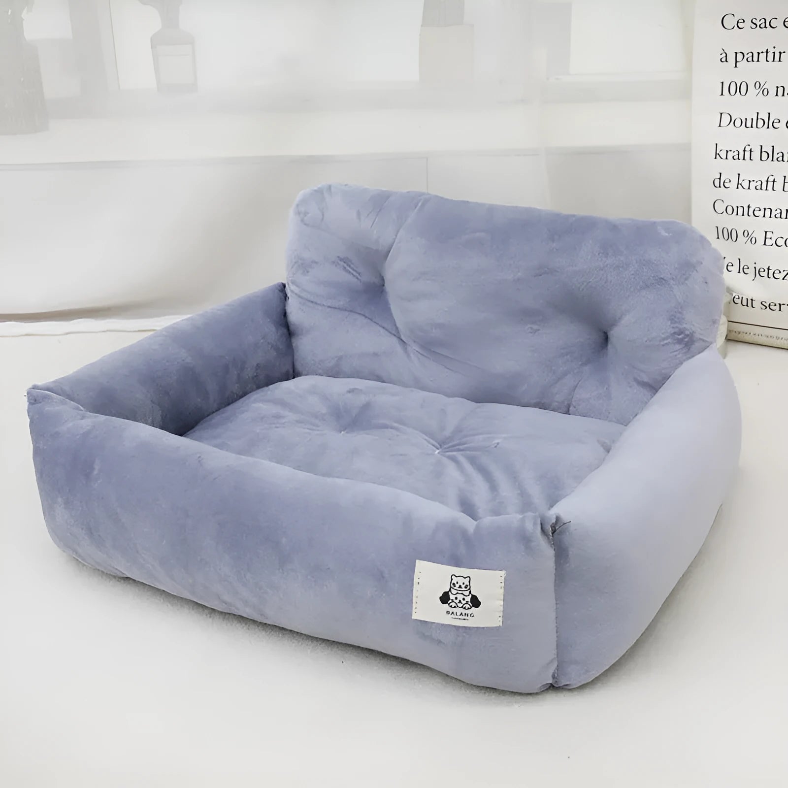 Blue plaid and grey stain-resistant cloth dog nest for car use, showing small and large size options.