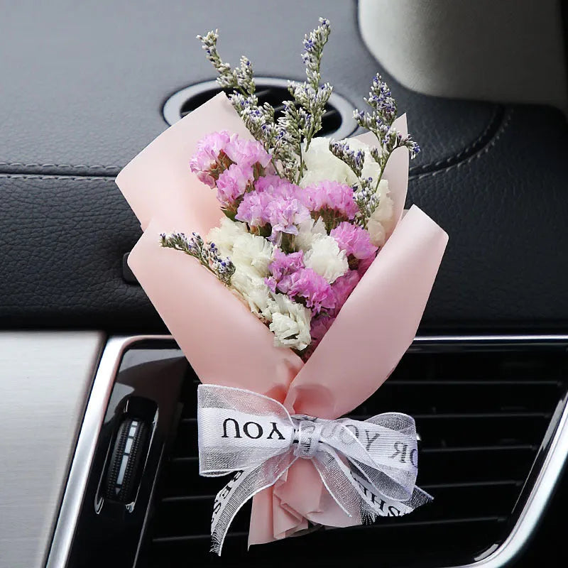 Dried flower car air freshener with natural aroma slices mounted on vehicle air conditioning vent