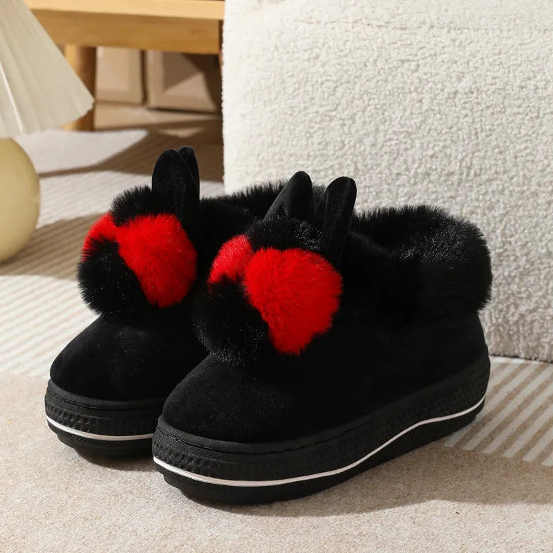 A pair of thick-soled high heel slippers in plush material with a TPR sole, shown in grey colour.