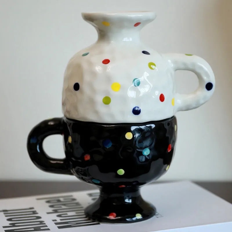 Hand-pinched irregular ceramic mug in a solid colour, showing its unique shape.