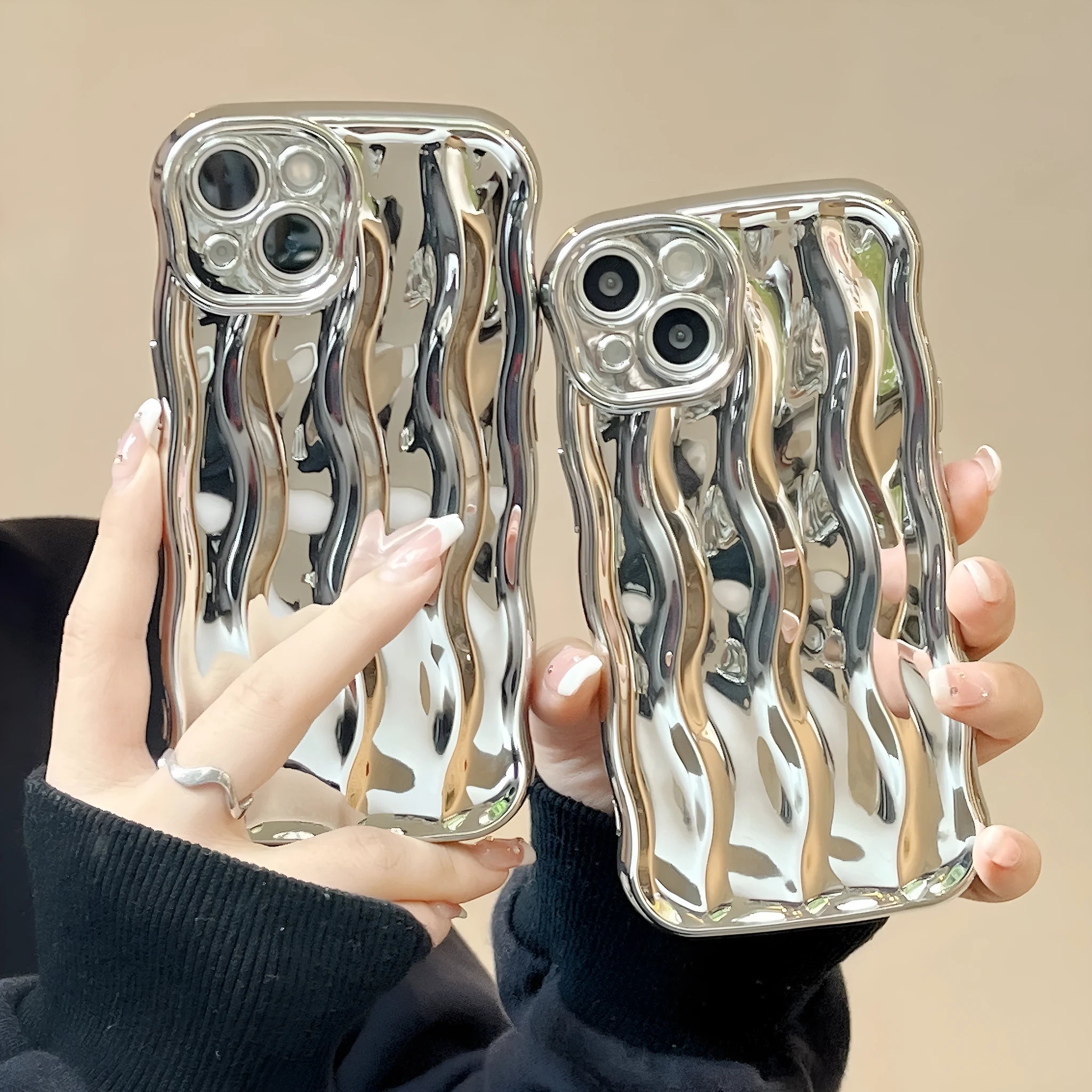 Electroplated 3D wave stripe protective case for iPhone 17 Pro Max in silver finish.