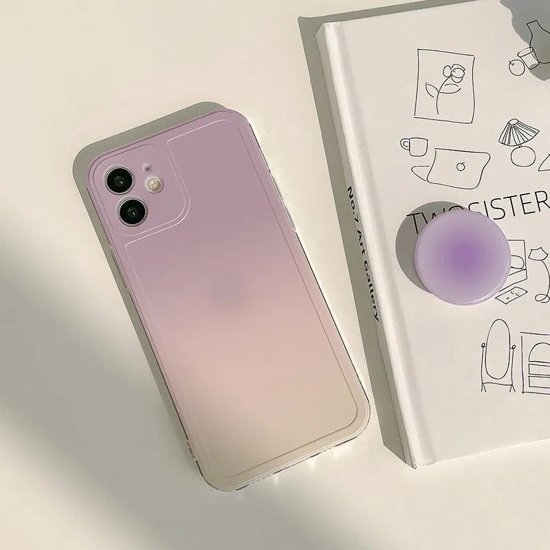 Yellow to purple gradient silicone protective case for iPhone on a table
