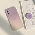 Yellow to purple gradient silicone protective case for iPhone on a table
