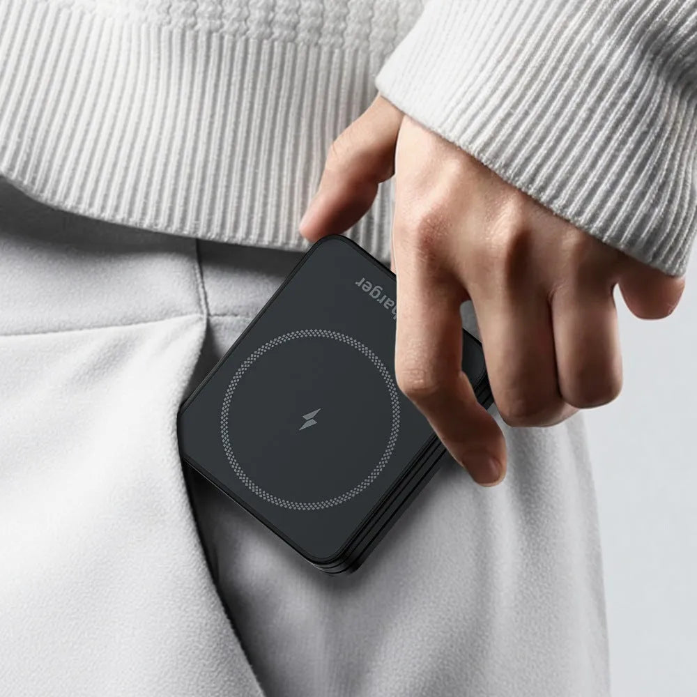 Three-in-one folding magnetic wireless charger in black or white with USB cable and manual