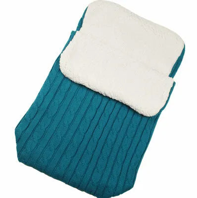 Envelope-style baby stroller sleeping bag in a plain colour, shown on a pram with lamb cashmere lining visible.