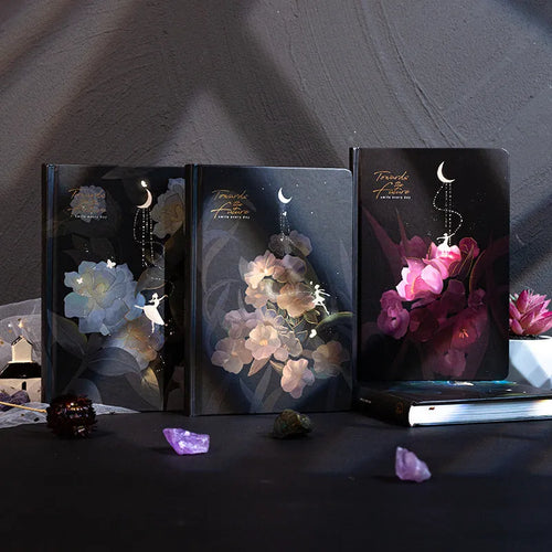 A5 size notebook with a luminous reflective cover, open to show internal pages with colour illustrations.