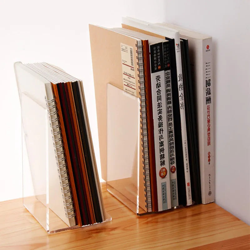 Transparent acrylic bookshelf displaying organised books on a study desk