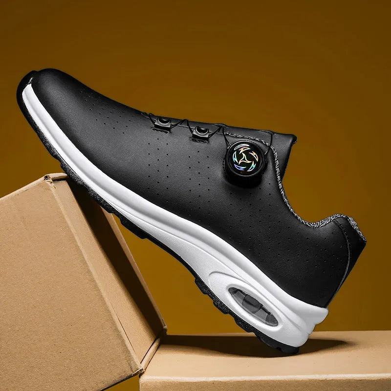 Low top black and white mesh casual shoes with cross shoulder straps and a composite sole.