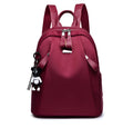 Medium Oxford cloth rucksack in wine red with double straps and internal organisation pockets
