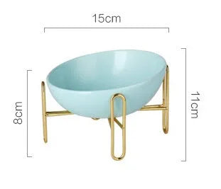 Ceramic pet bowl in blue with non-slip shelf, size M 600ml, on a wooden floor