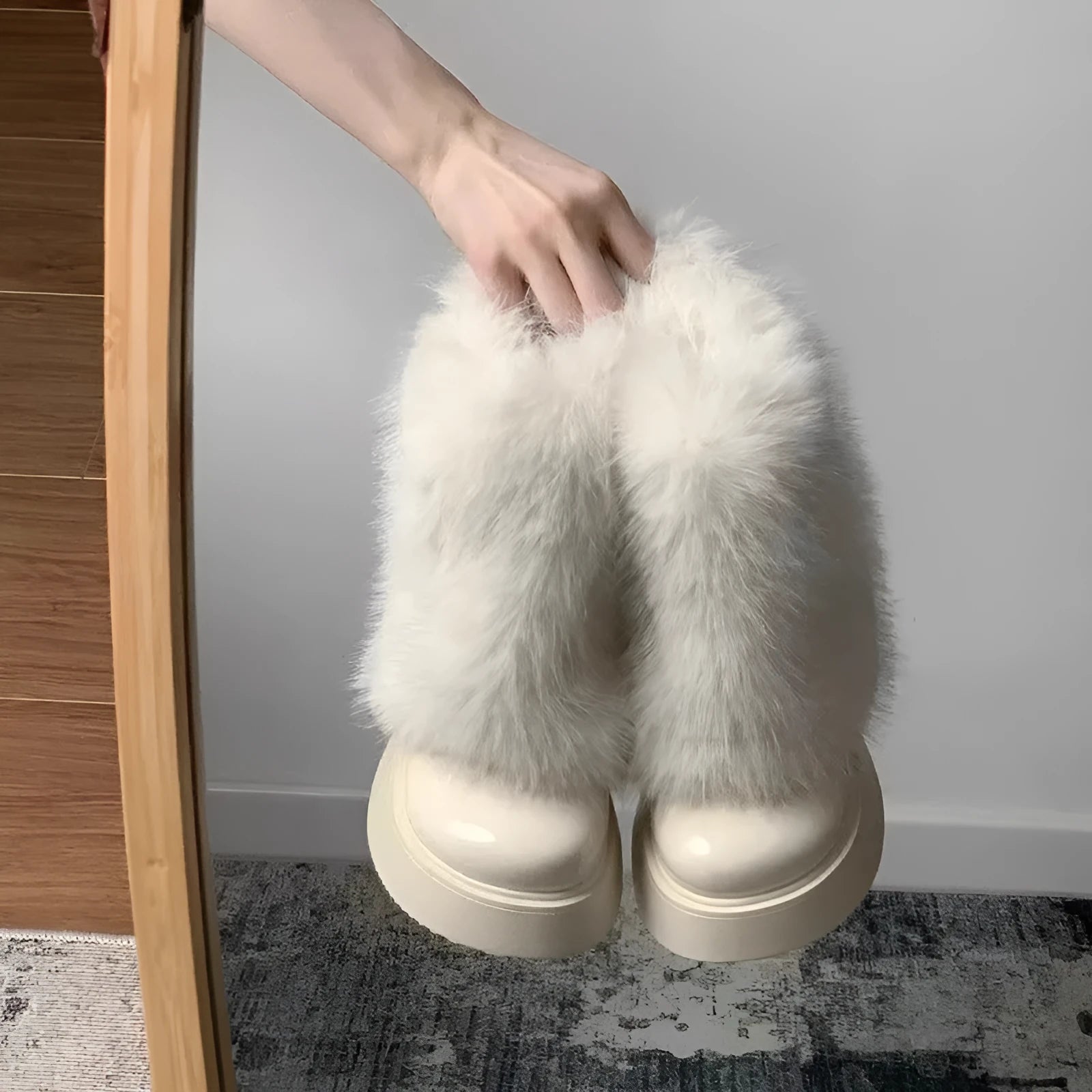 Women's black artificial plush low-top snow boots with a round toe and waterproof rubber sole.