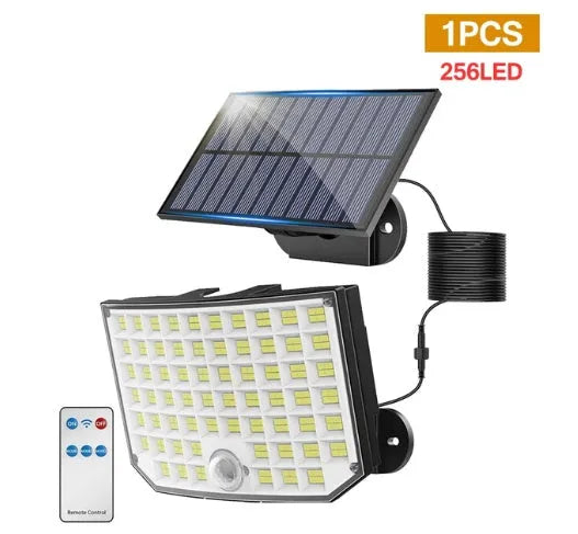 Solar-powered outdoor garden lamp with motion sensor on a wall