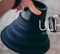Black conical silicone camera lens hood for reducing glare on glass, shown in large and small sizes.