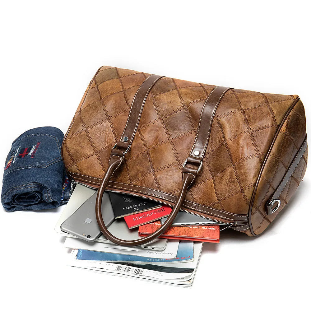 Men's brown leather duffel bag with a single strap and internal organiser pockets