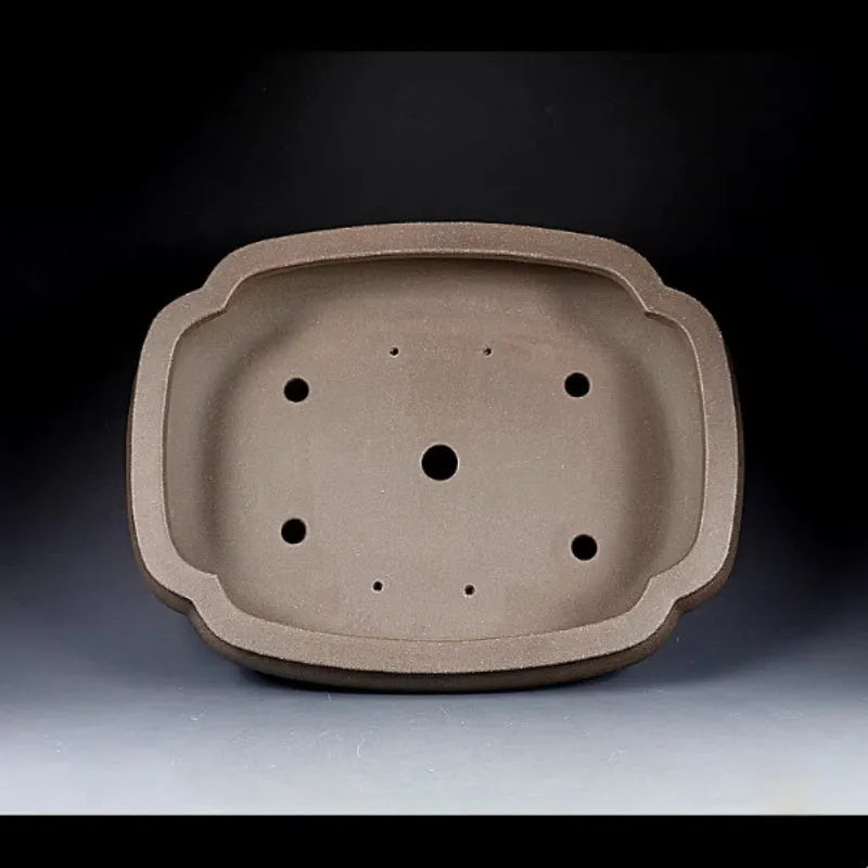Handmade antique papaya-shaped flower pot made from natural purple clay.