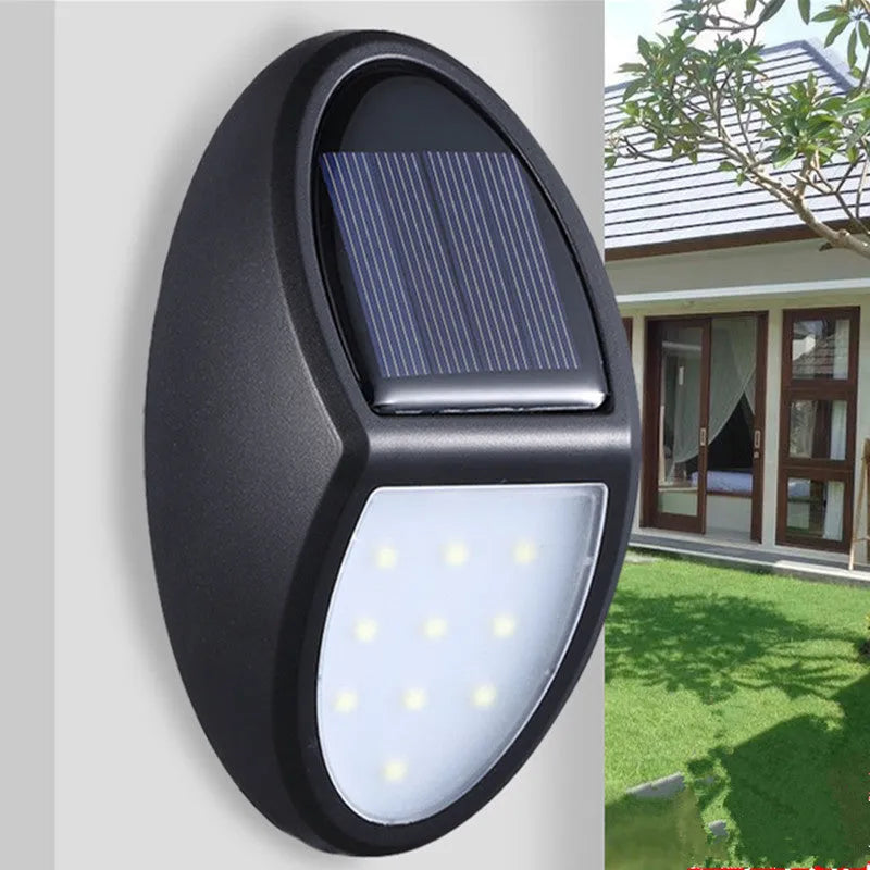 Black rectangular solar-powered LED wall light for outdoor automatic lighting.