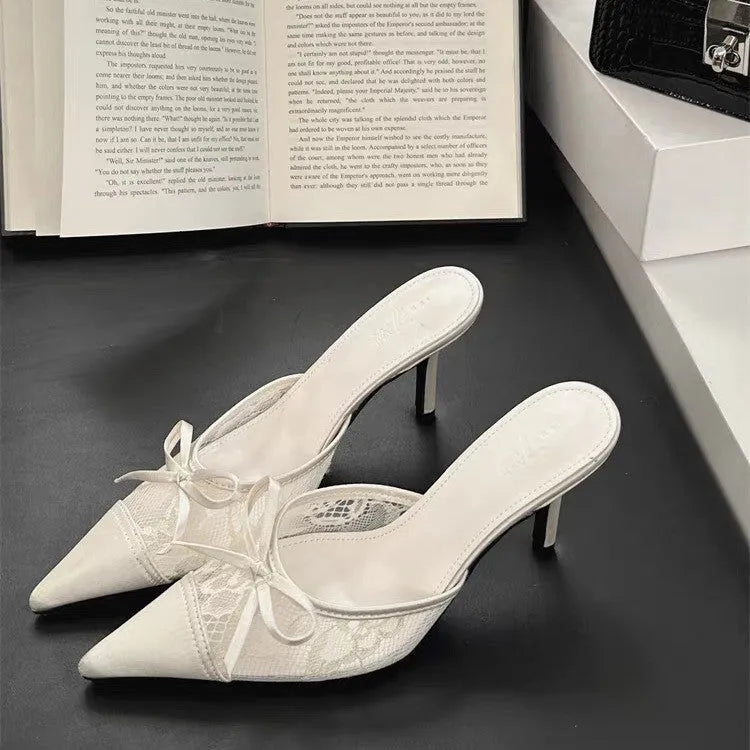 Women's lace-inspired pointed toe high heels with a bowknot detail on the mesh upper.