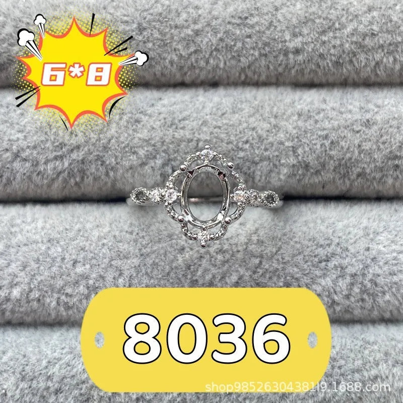 Oval denier ring with 6x8 mm stone and five-pointed star accent on open mouth copper band
