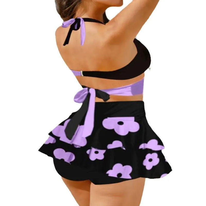 Women's purple lace-up bikini top and matching split skirt swimsuit set.