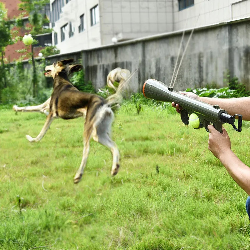 Black tennis shooting gun pet toy with two tennis balls measuring 65.5 cm long