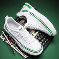 Youth low-top slip-on canvas sneakers in white black, side view