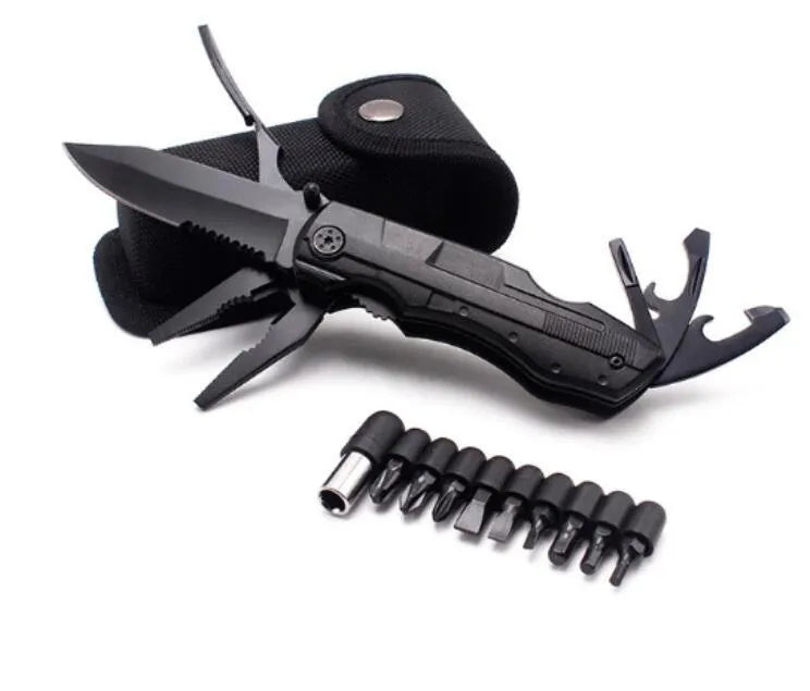 Black multi-purpose folding pliers tool with 7.5cm blade and aluminium handle on a flat surface