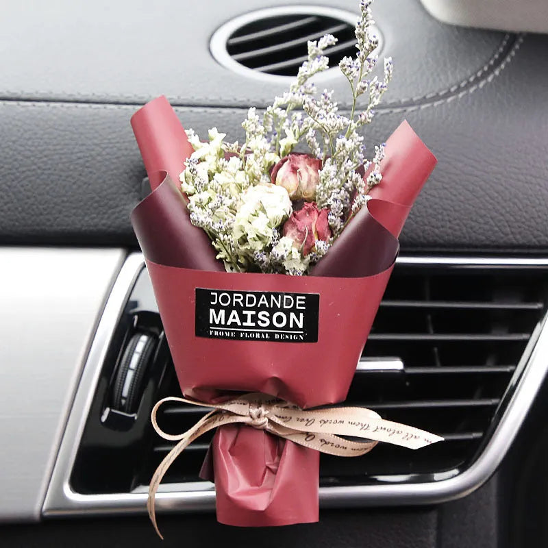 Dried flower car air freshener with natural aroma slices mounted on vehicle air conditioning vent