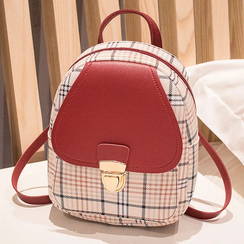 A diagonal one shoulder phone bag in PU fabric, shown in a choice of five colours.