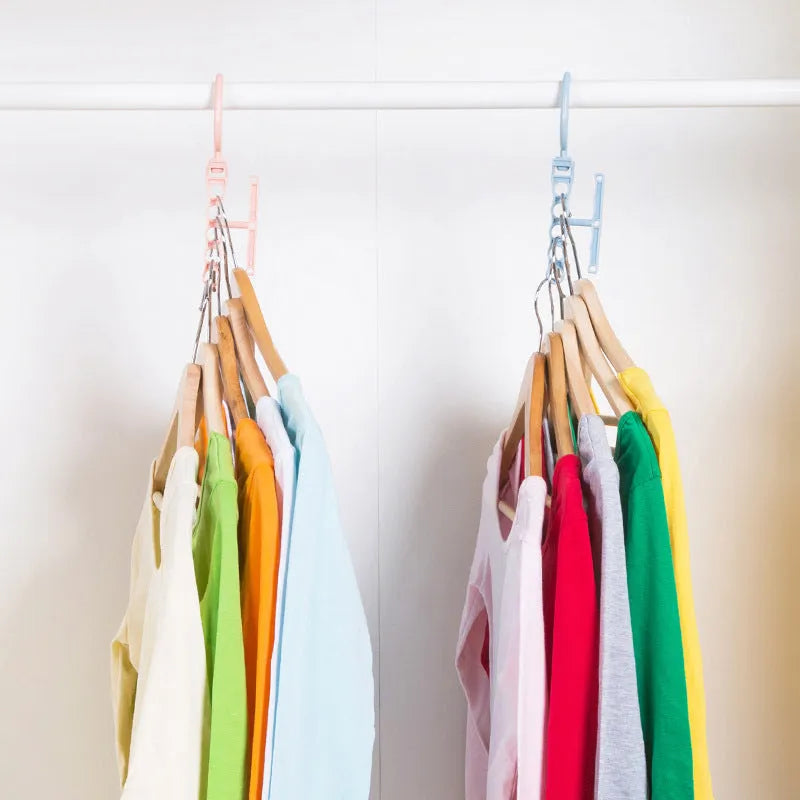 Blue revolving wardrobe hanger with five holes and handle for organising multiple garments