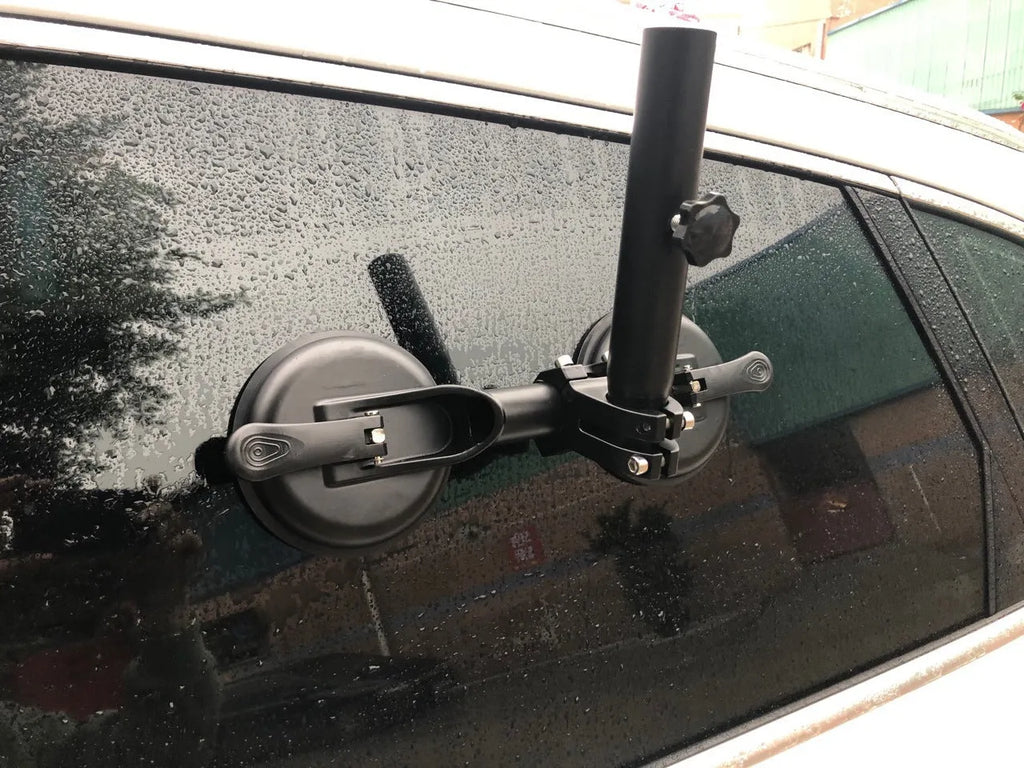 Black off-road car windscreen sucker mount with a large round rubber suction cup for flagpoles.