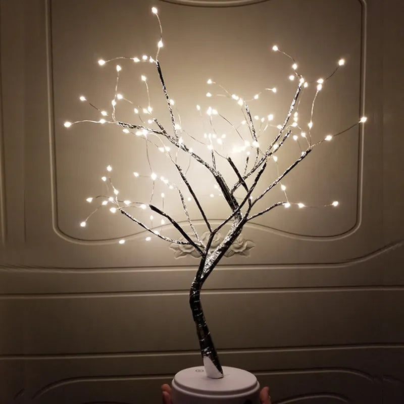 Tree light night light with bonsai-style design, warm white LED lights, adjustable branches, and USB plug.