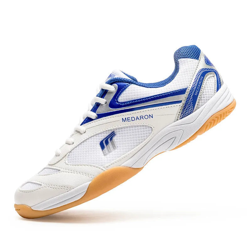 Mesh table tennis sneaker in white and red colour with lace-up front and rubber sole.