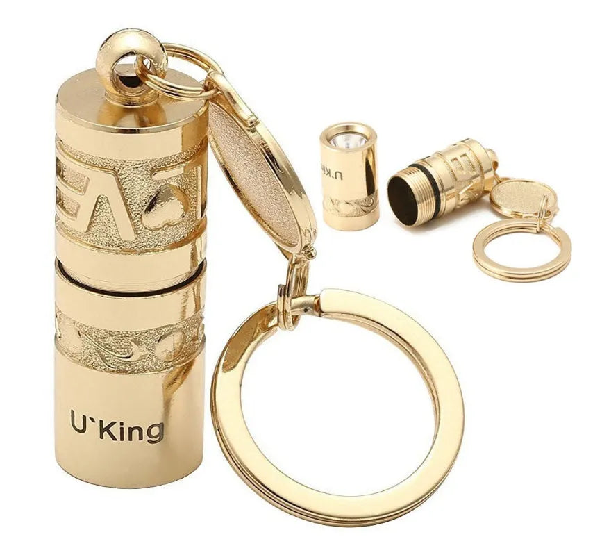 Gold-finish zinc alloy waterproof LED keychain torch with compact design for portable emergency lighting
