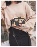 Women's hard PU leather shoulder bag with single adjustable strap and flap closure