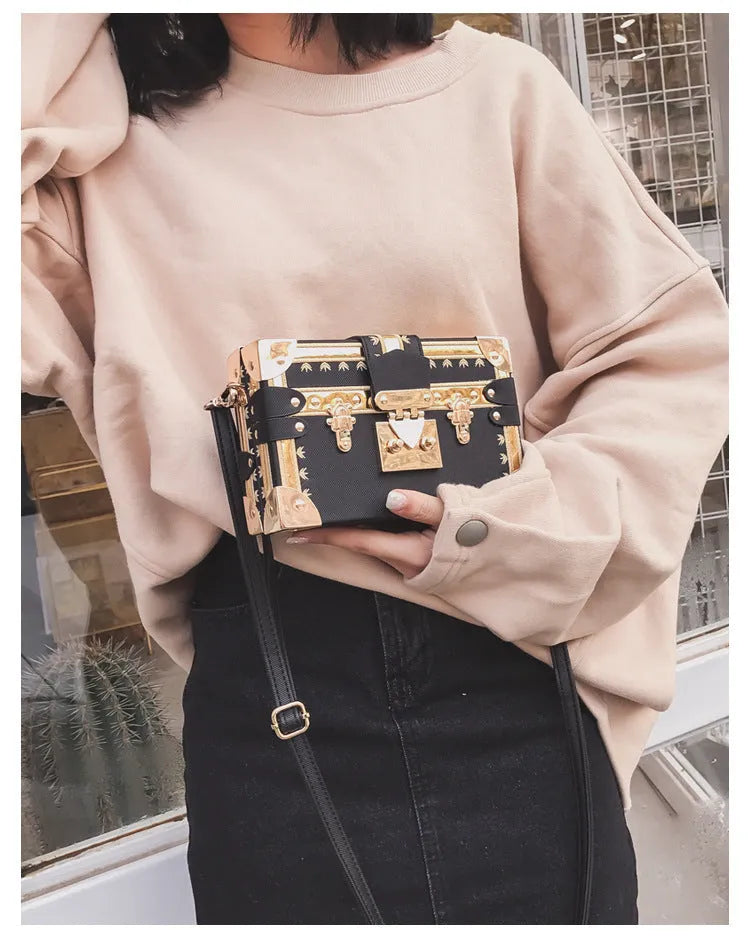 Women's hard PU leather shoulder bag with single adjustable strap and flap closure