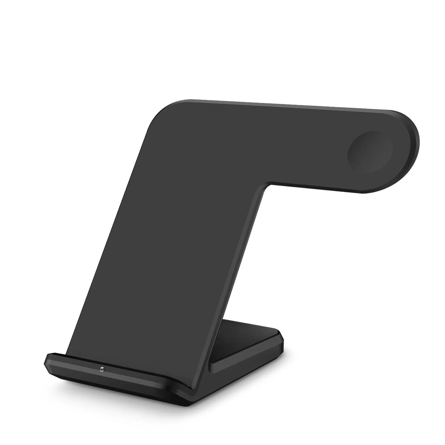 Black or white Qi wireless charging pad for mobile phones on a desk.