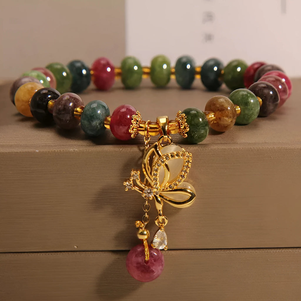 Colourful tourmaline bead and butterfly charm on women's alloy bracelet