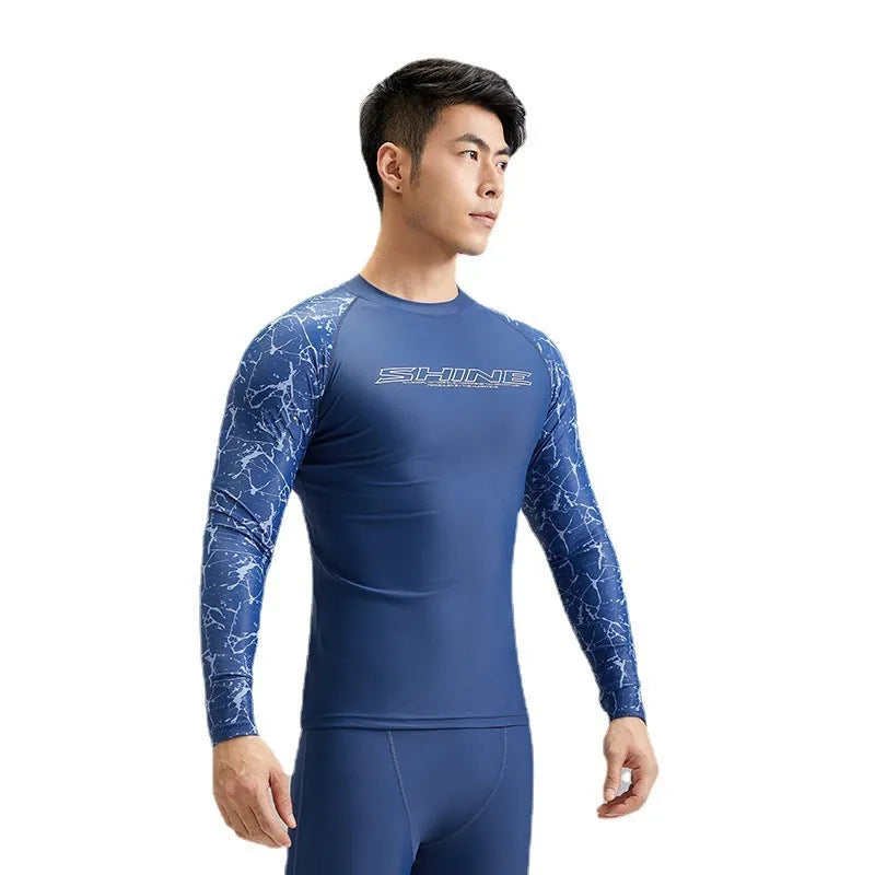 Dark blue men's two-piece swimwear set with a top and trousers on a mannequin.