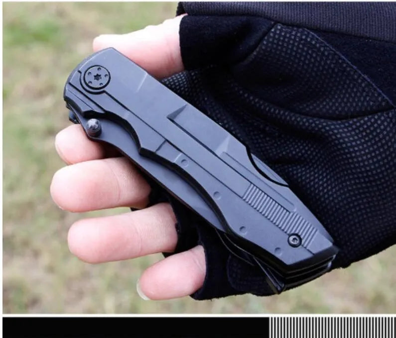 Black multi-purpose folding pliers tool with 7.5cm blade and aluminium handle on a flat surface